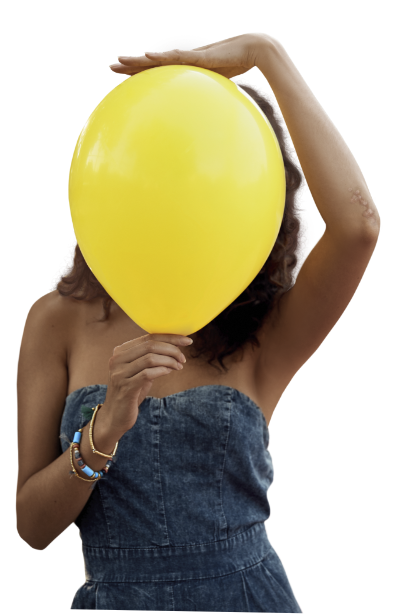 A woman holding a yellow balloon over her face