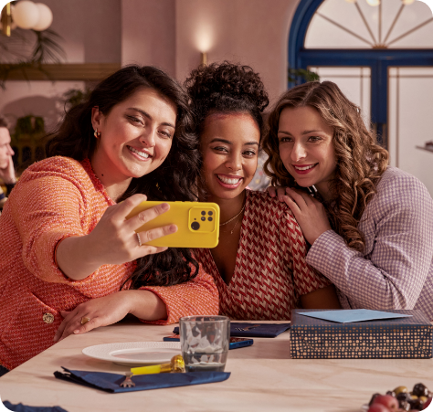 Three women taking a picture at brunch